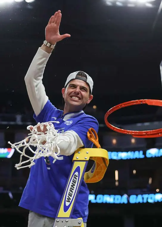 man holding basketball net