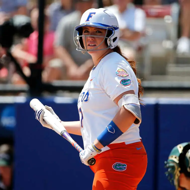 softball player holding bat